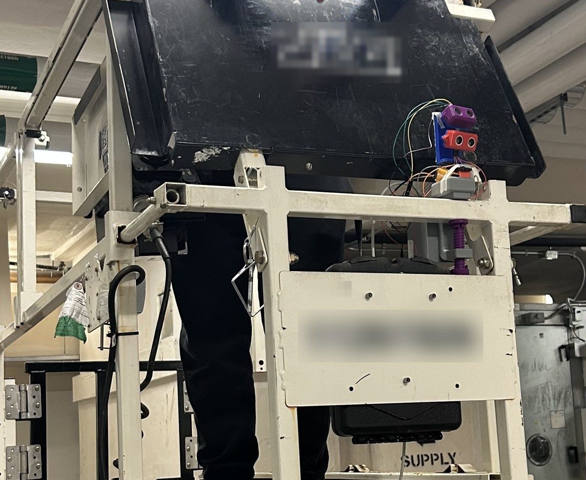 Generation 1 sensor module mounted on a scissor lift guardrail